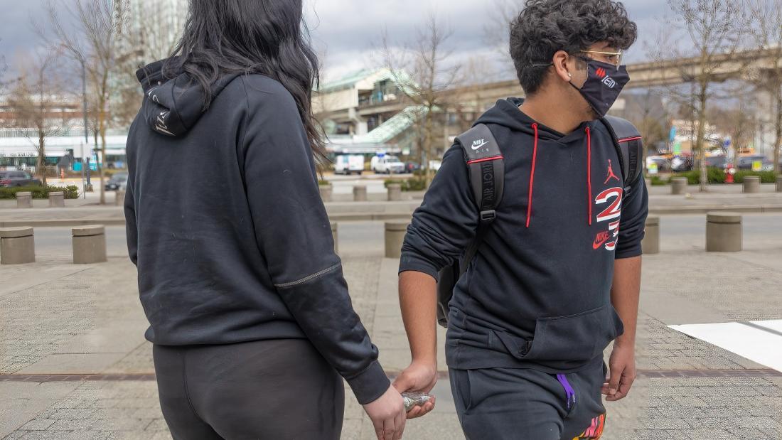 Two youth exchanging drugs 