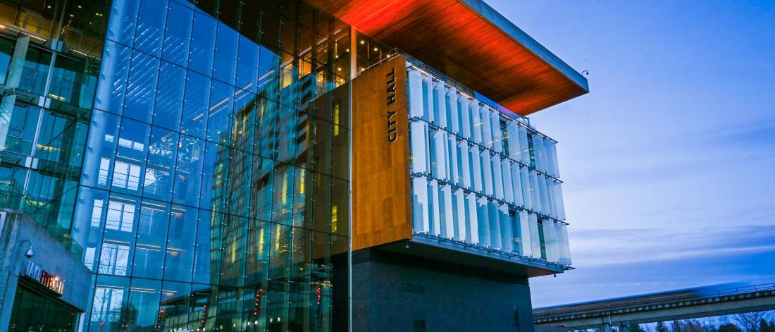 External view of Surrey City Hall at dusk as viewed from the plaza